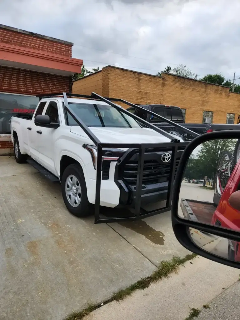 Custom fabricated grille guard mounted on a pickup truck