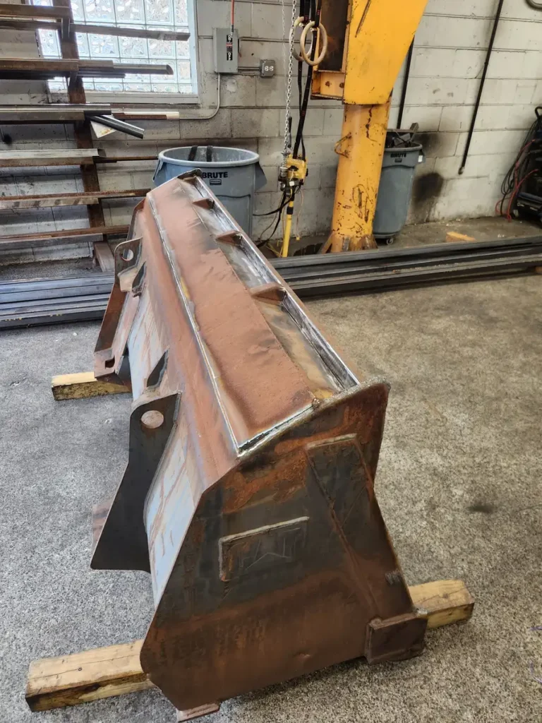 Loader bucket repaired in the welding shop